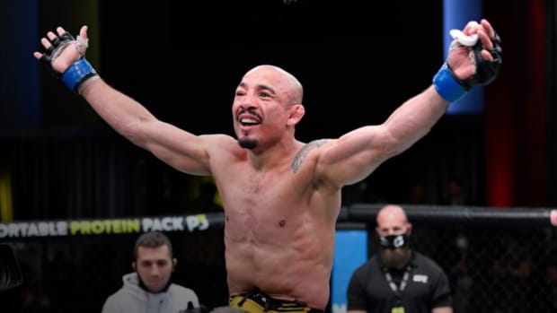 Jose Aldo celebrates a victory inside the UFC Octagon.